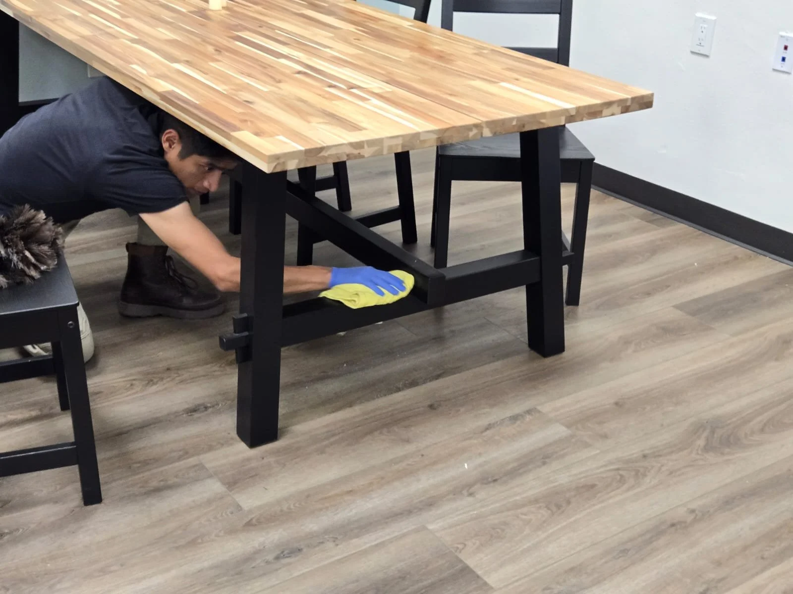 Technician detail-scrubbing floors after construction in San Diego