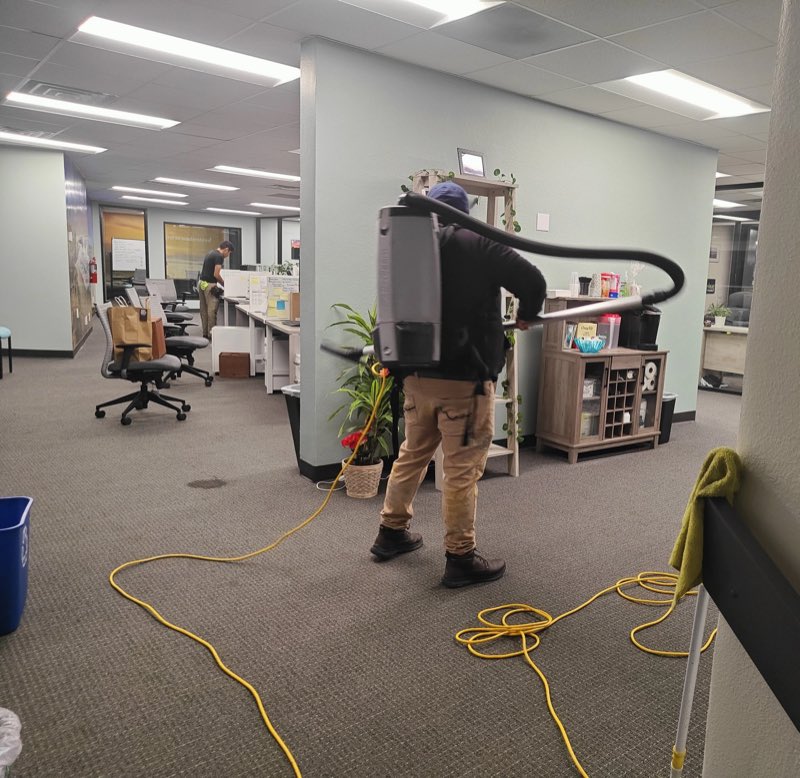 Oracle Group Services team cleaning a commercial office